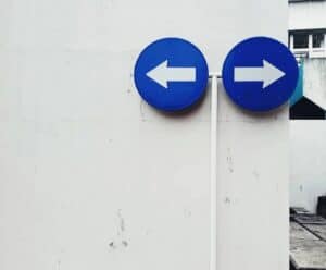 Two directional arrows representing a choice between ad platforms