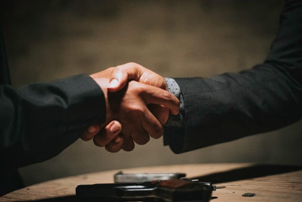 Business team shaking hands after choosing an agency