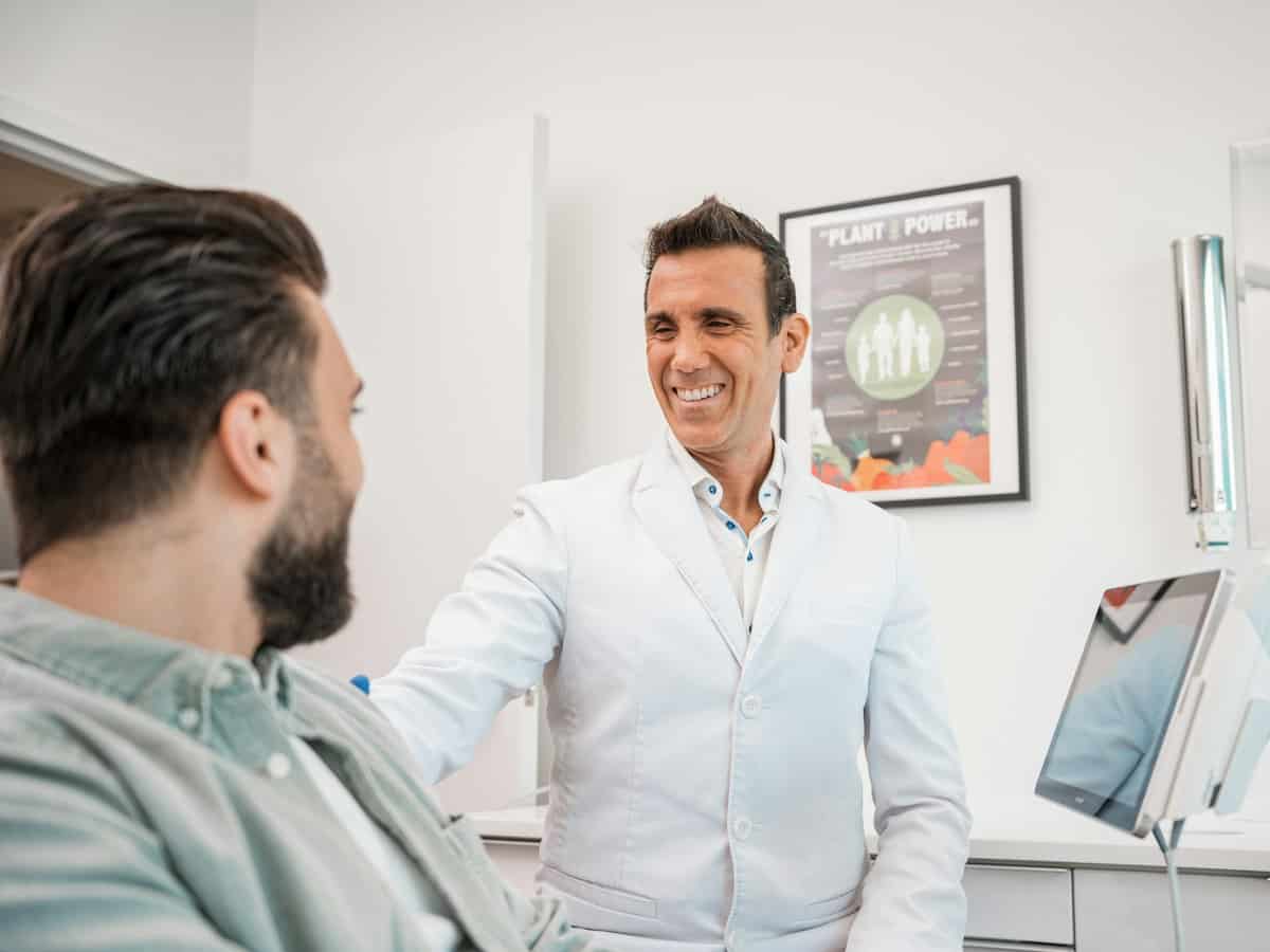 Dentist talking with a new patient at the clinic