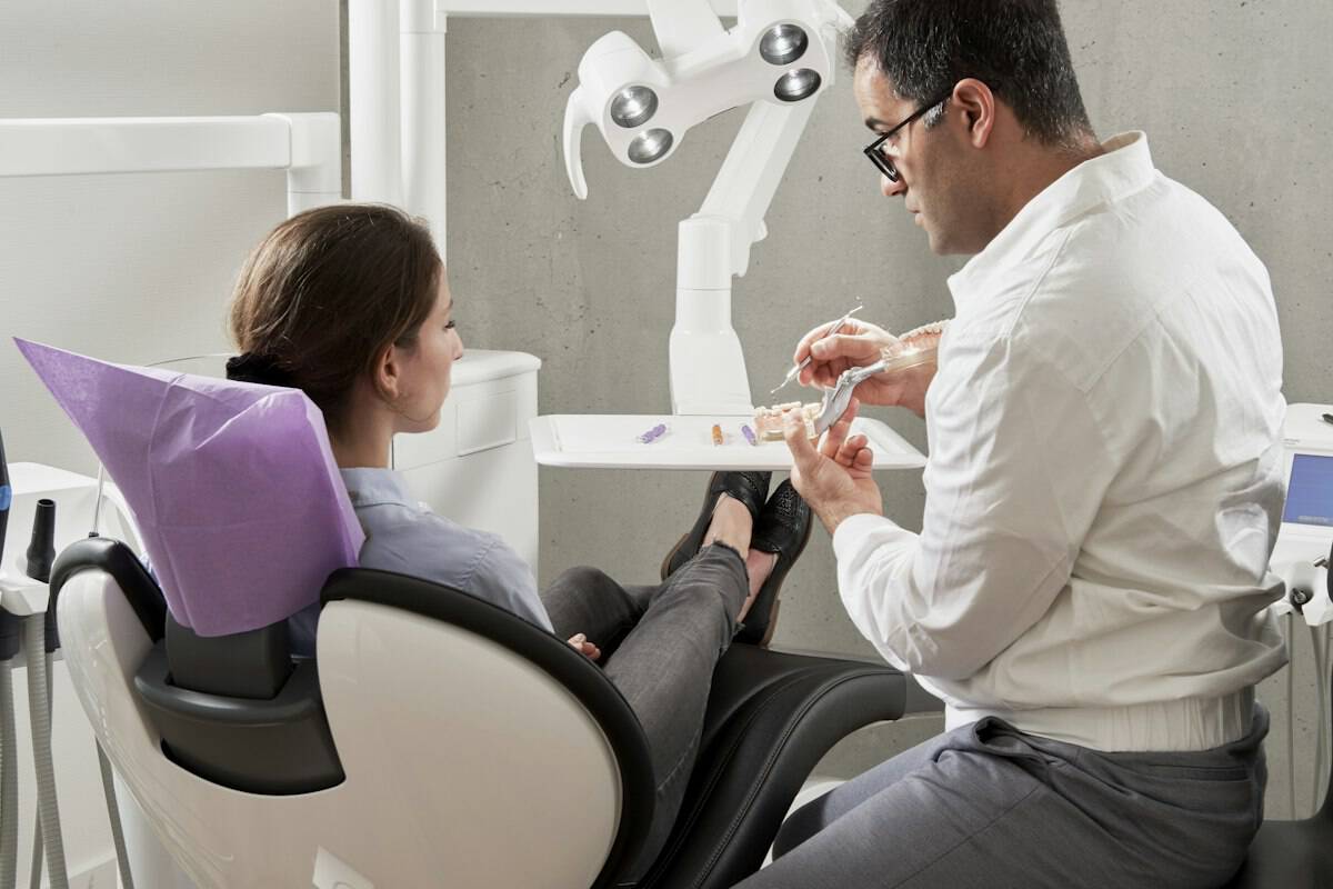 Dentist treating a patient in the dental chair