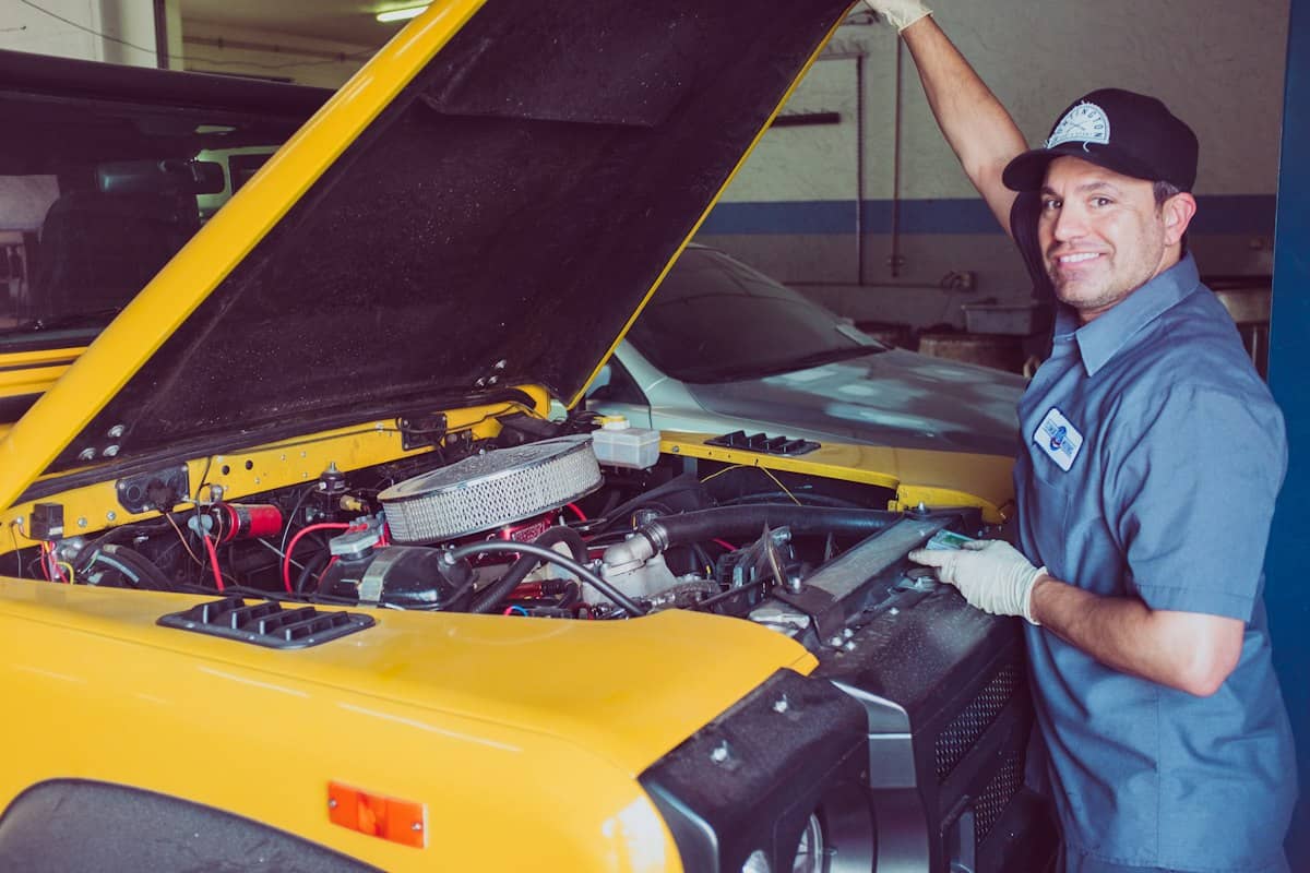 Mechanic working under the hood of a car