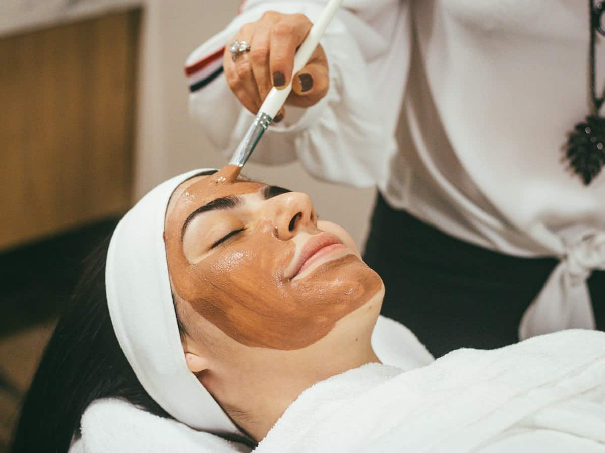Client receiving a facial mask treatment